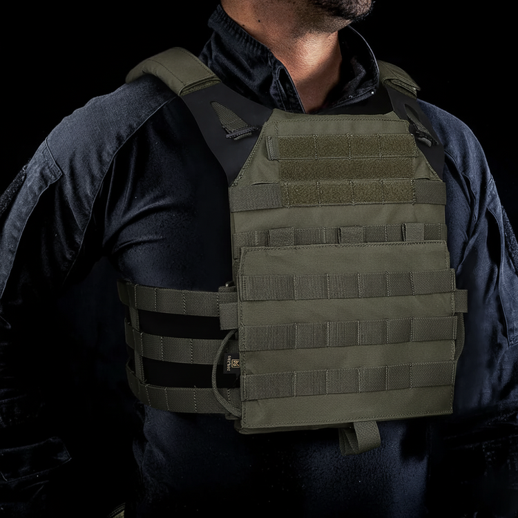 Person wearing a tactical vest on a black background