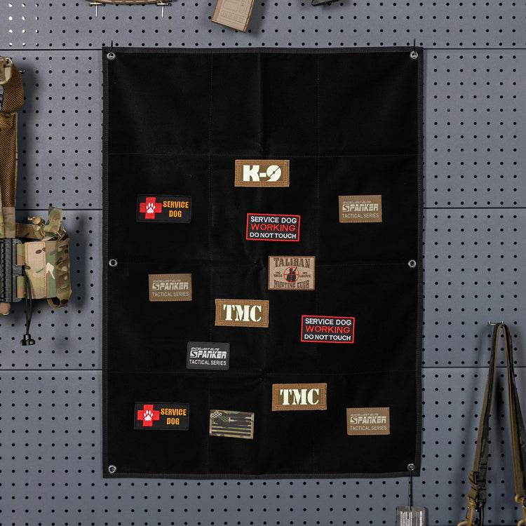 Black patch holder with various patches on a pegboard background