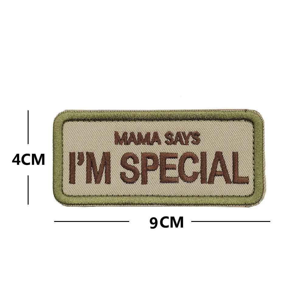 Patch with 'Mama says I'm special' text and dimensions on a beige background