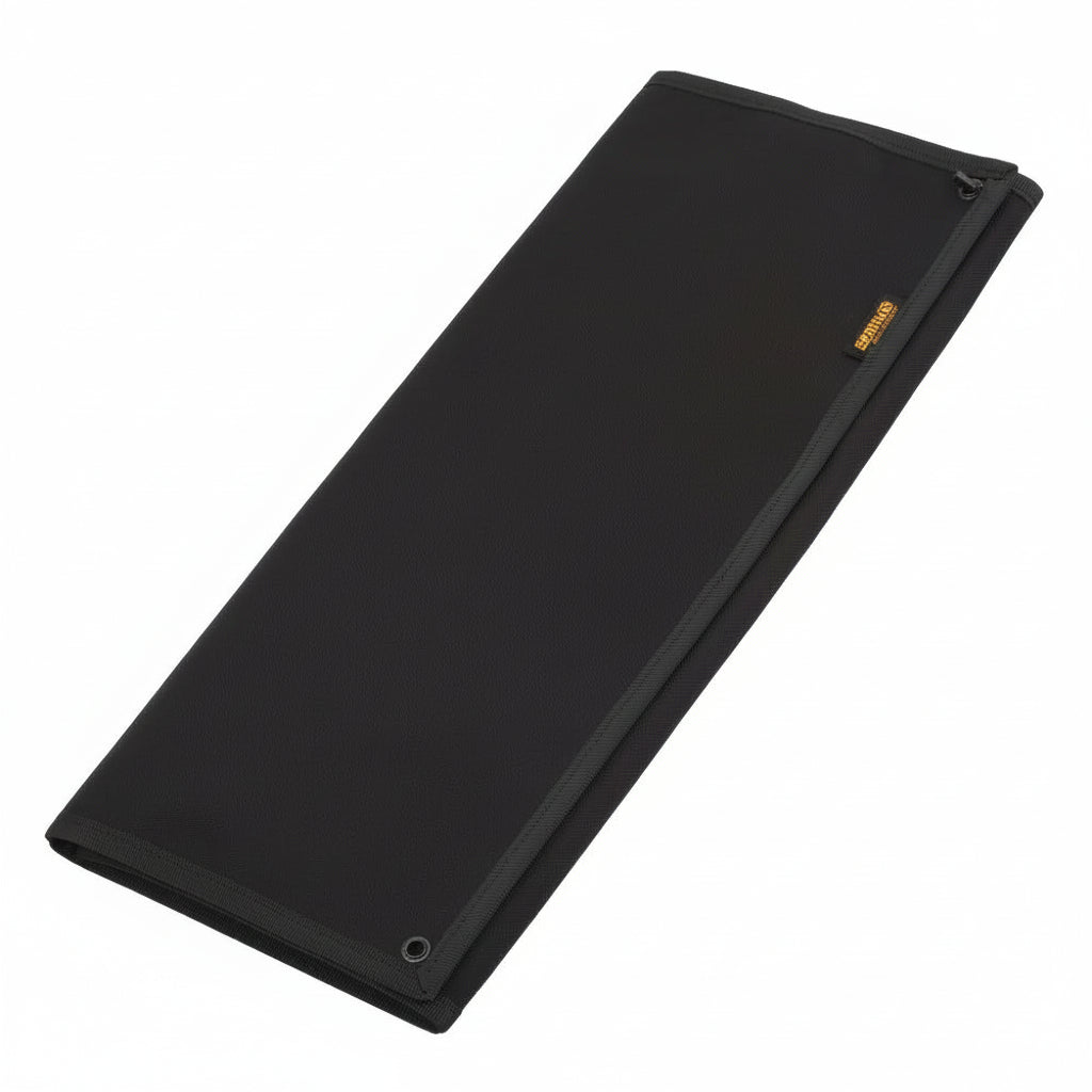 Folded up black hook and loop patch display board on a white background