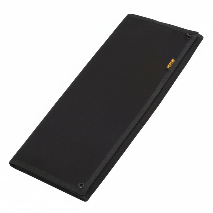 Folded up black hook and loop patch display board on a white background