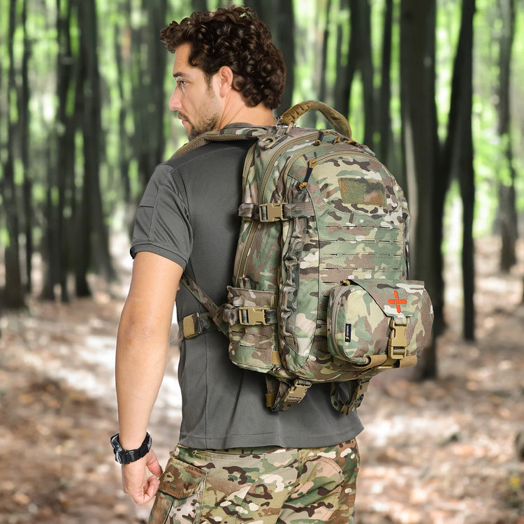 Man wearing a camouflage backpack in a forest setting