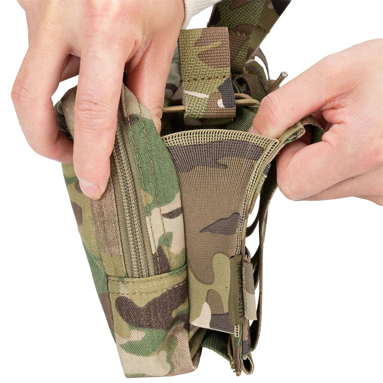 Camouflage pouch with zippers held by hands on a white background
