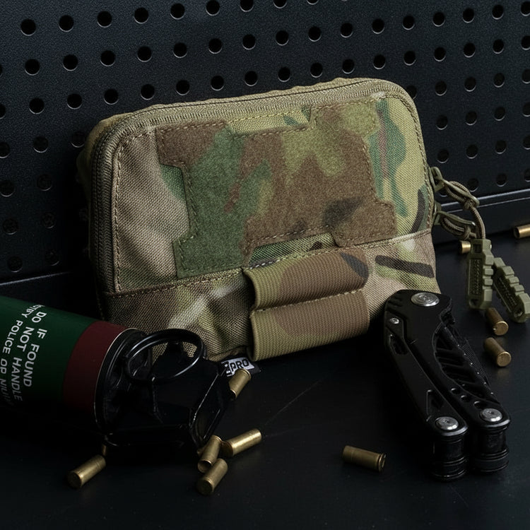 Camouflage tactical pouch with tools and ammunition on a pegboard background.