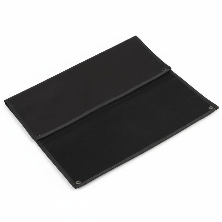 Folded black hook and loop patch display board with a white background