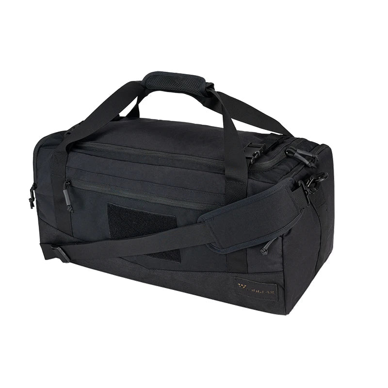 Black duffel bag with multiple straps on a white background