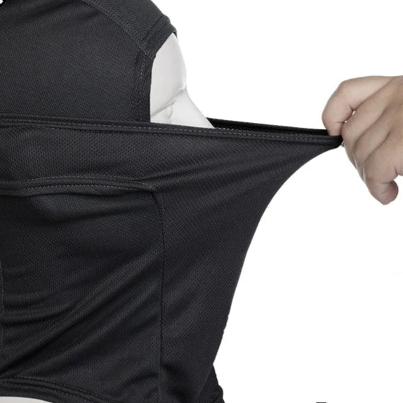 Person stretching face mask against a white background