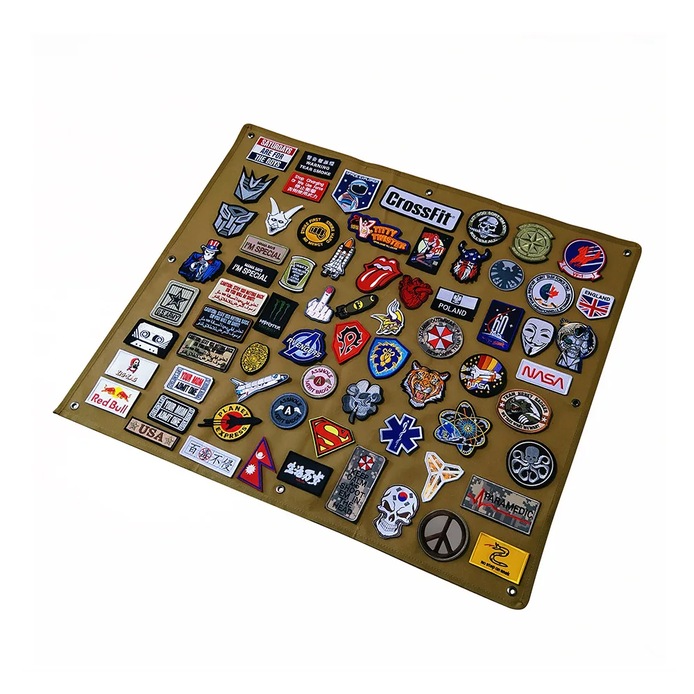 Collection of various badges and patches on a brown hood and loop display board with a white background