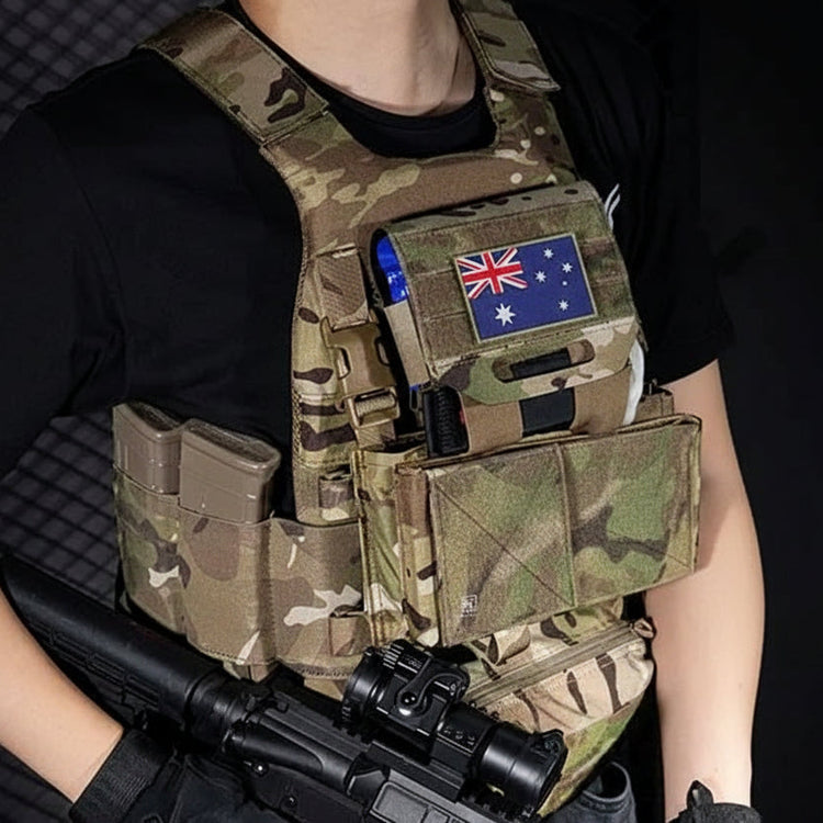 Person wearing a camouflage tactical vest with a black background
