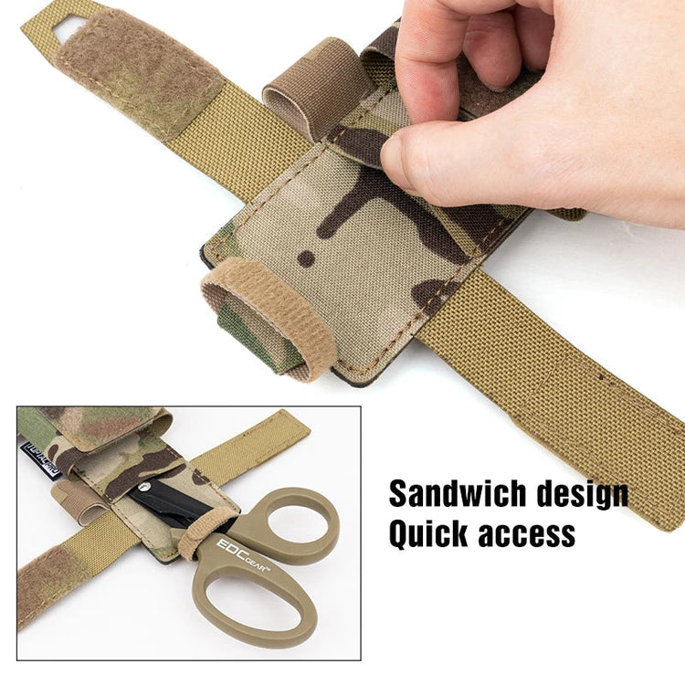 Camo strap with quick access feature and a pair of scissors, on a white background.
