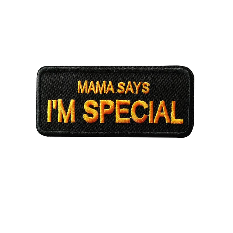 Black patch with orange text 'MAMA SAYS I'M SPECIAL' on a white background