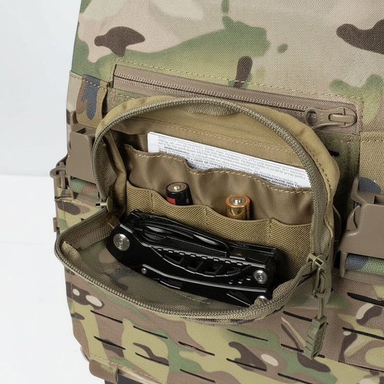 Camouflage backpack with open compartment showing tools and batteries.