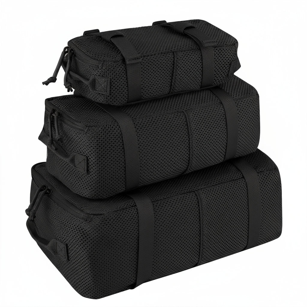 Three black Krydex bags stacked on a white background