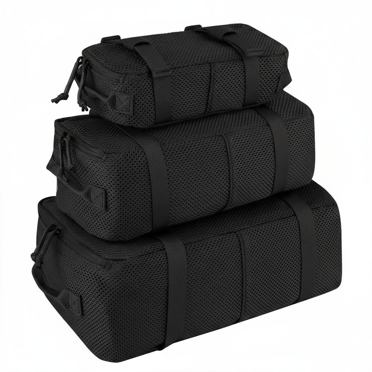 Three black Krydex bags stacked on a white background
