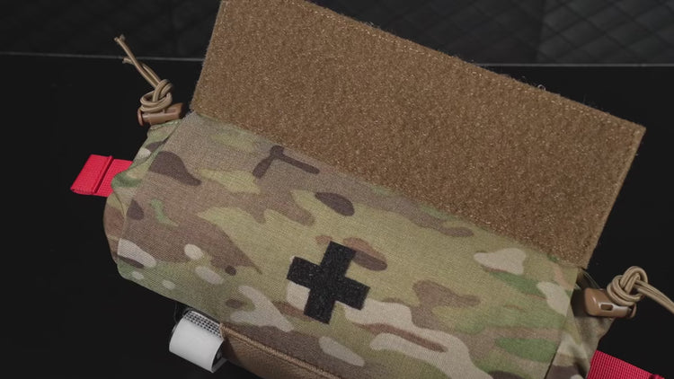 video of a multicam camo roll up first aid kit pouch