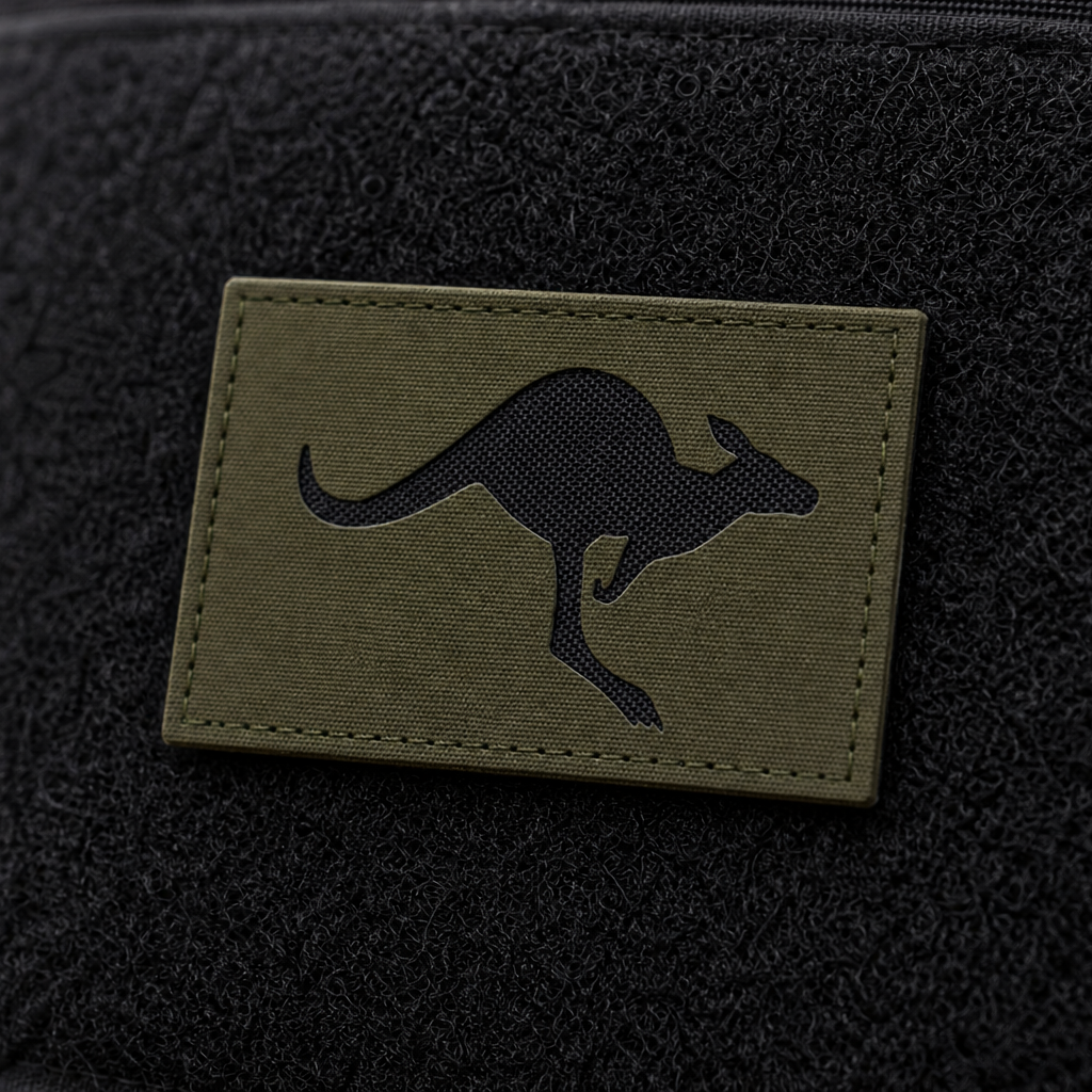 Olive Green Skippy Patch with recessed black nylon backing on a tactical pack