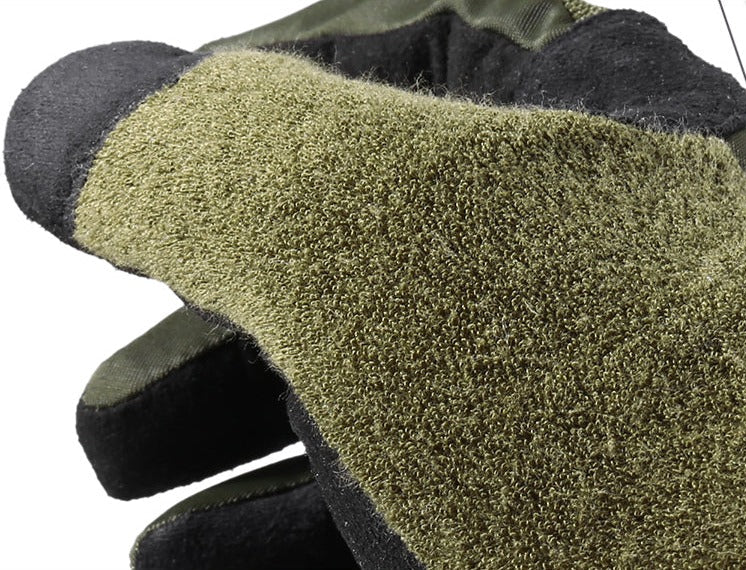 Close-up of green gloves with textured thumb and black cuffs on a white background